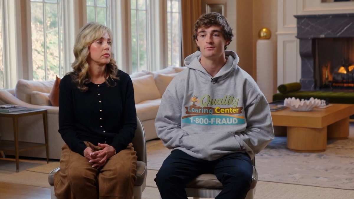 Nick Shirley sits for an interview, wearing a "Quality Learning Center" hoodie