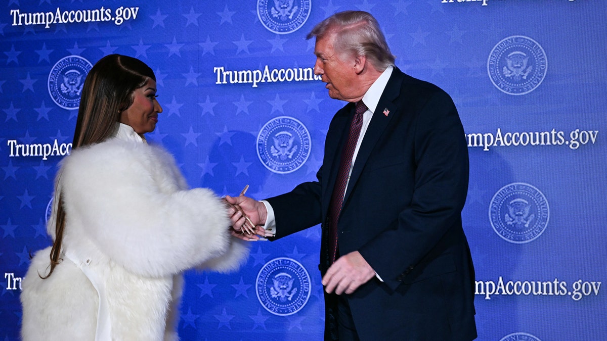 Nicki Minaj shakes hands with donald trump