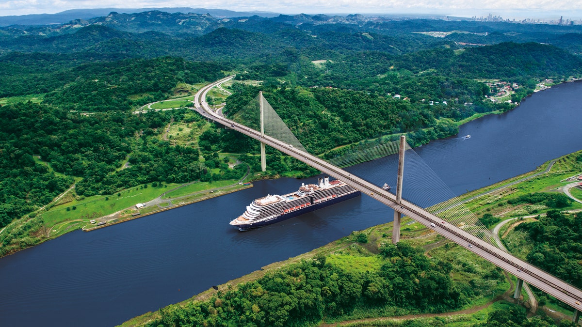 Holland America Line ship passing panama canal aerial shot