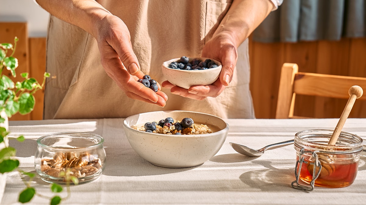 People add blueberries to oatmeal.