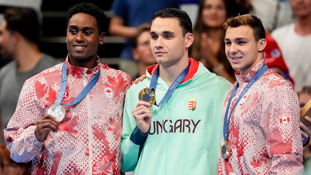 Ilya Kharun holds his medal