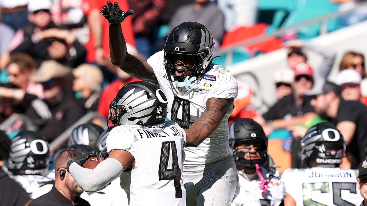 Malik Benson celebrates
