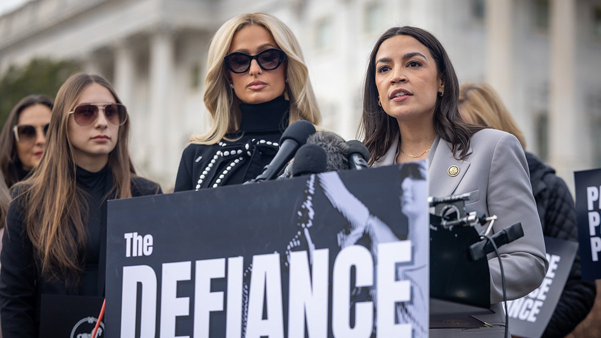 Paris Hilton speaking alongside Alexandria Ocasio-Cortez outside of the Capitol