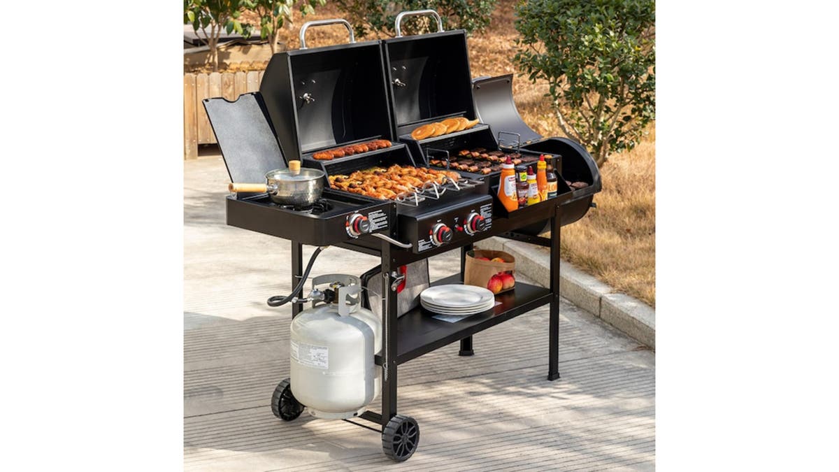 This grill is packed with features like a side burner, charcoal smoker and a front storage tray. 