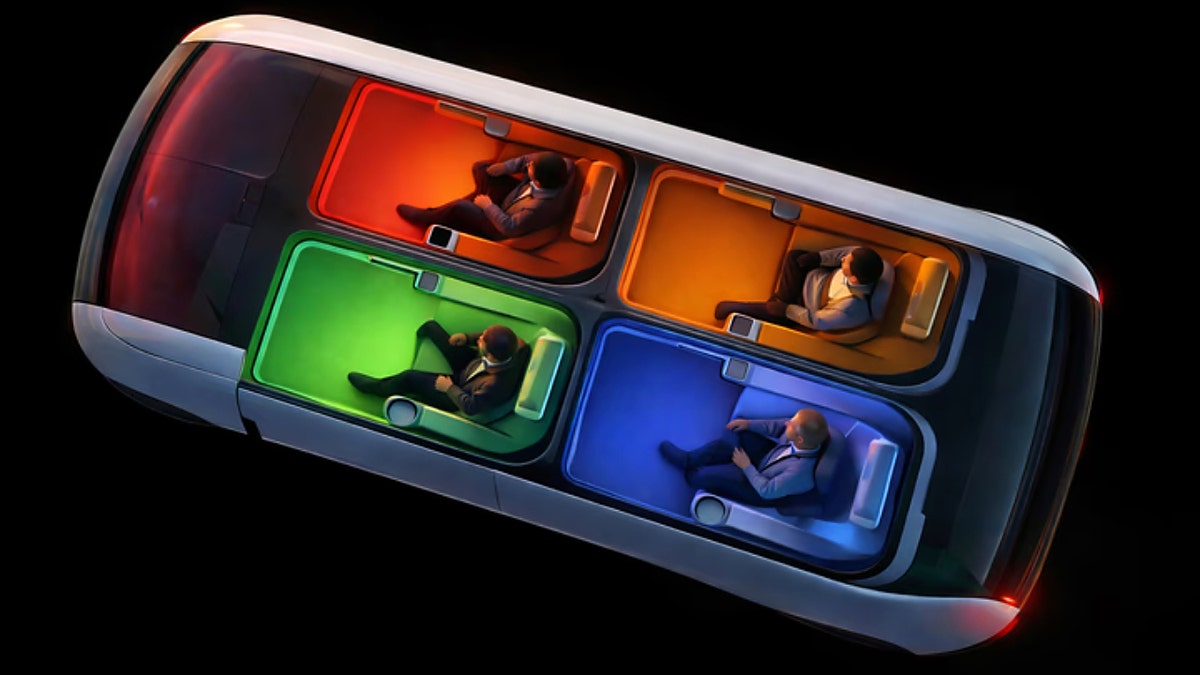 4 people sitting in individual pods in a car.