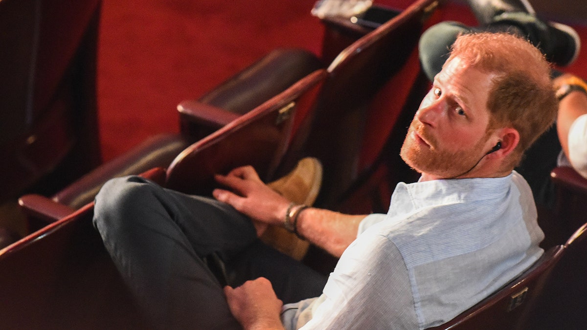 Prince Harry looking up at the camera.