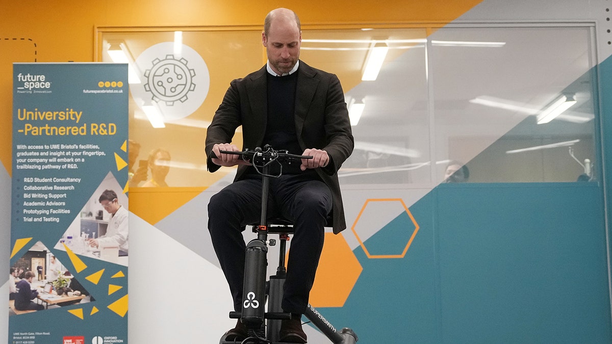 Prince William riding a mobility scooter during a royal engagement in the U.K.