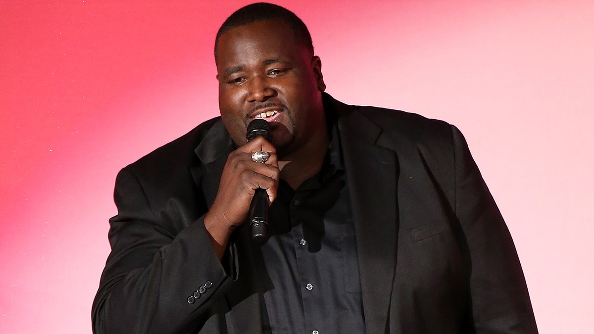 Quinton Aaron performing on stage in California in October 2018.