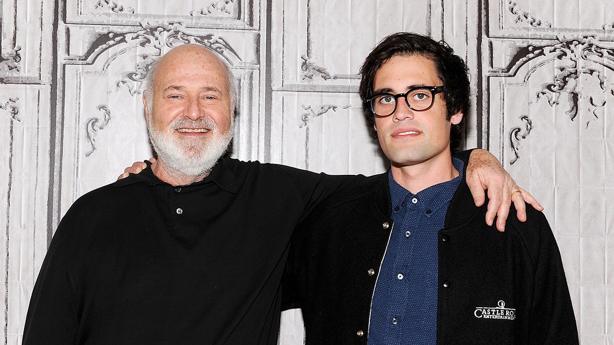 Rob Reiner stands with his arm around his son, Nick Reiner