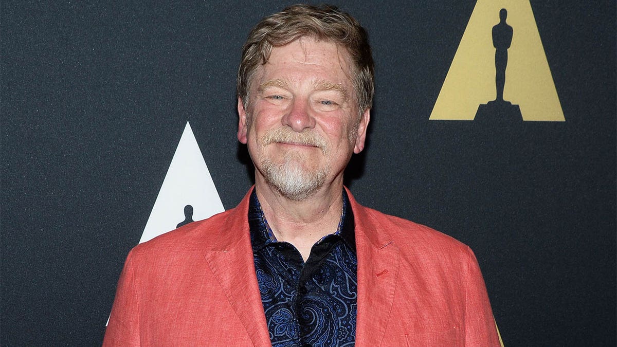 Roger Allers smiles on red carpet