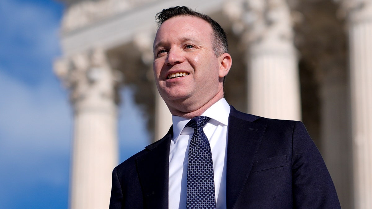 Joshua Block walks down the steps of the Supreme Court