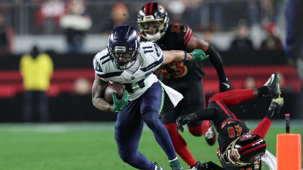 Jaxon Smith-Njigba #11 of the Seattle Seahawks carries the ball against the San Francisco 49ers during the second quarter of a game at Levi's Stadium on Jan. 3, 2026 in Santa Clara, California.