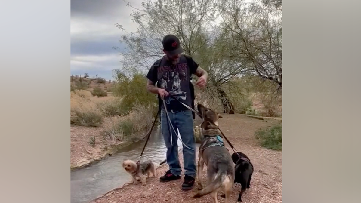 Danny Lyn Kaster, 52, is shown with his dogs in an undated photo