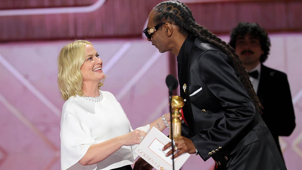 Snoop Dogg and Amy Poehler on stage at Golden Globes