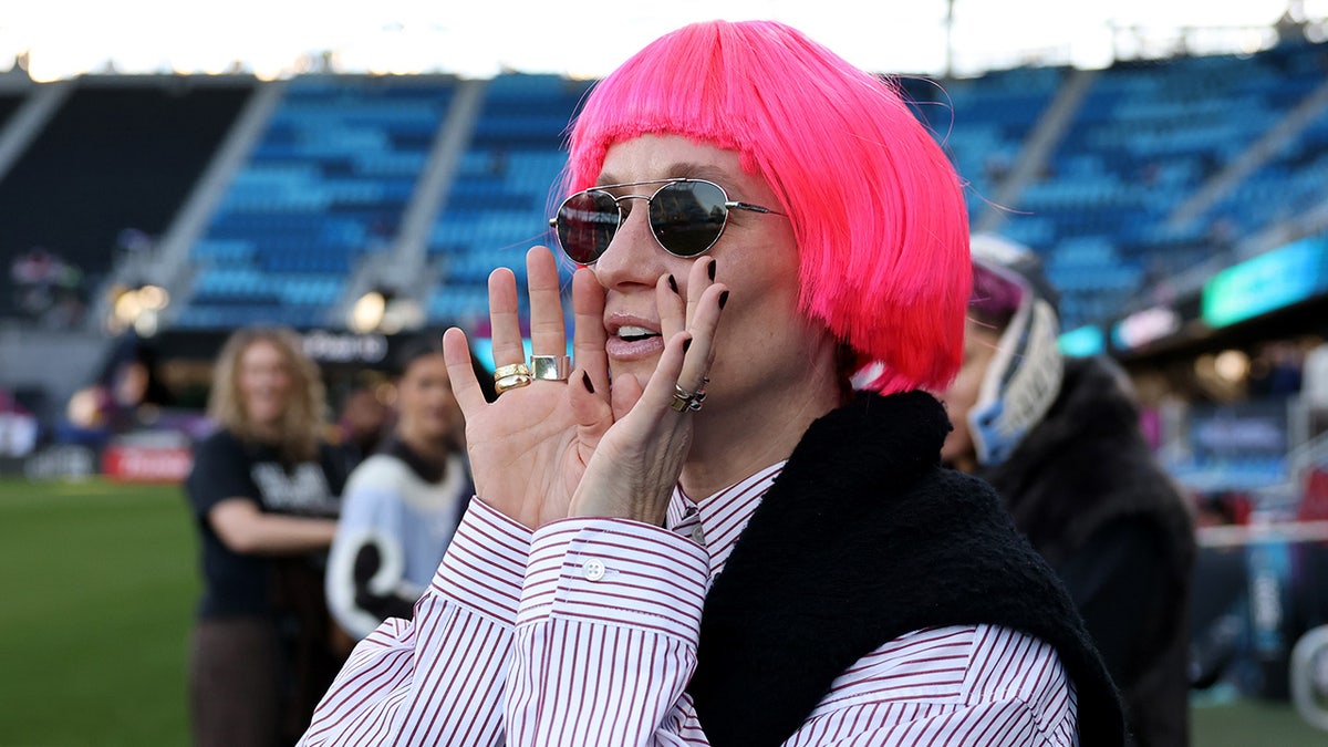 Megan Rapinoe yells at an NWSL game