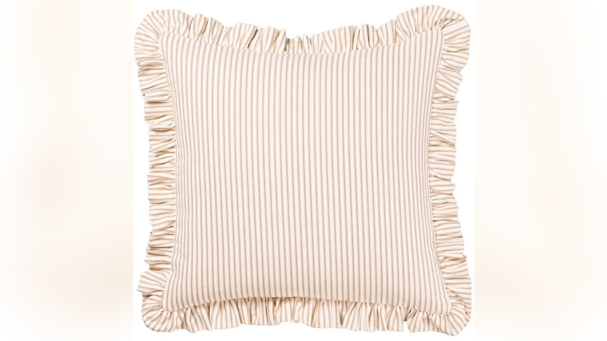 An accent pillow with a timeless design is a solid way to participate in the stripes frenzy. 