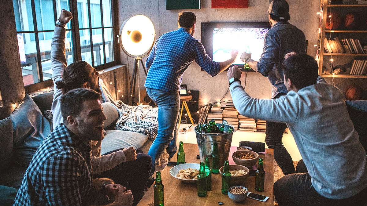 Friends watching Super Bowl game