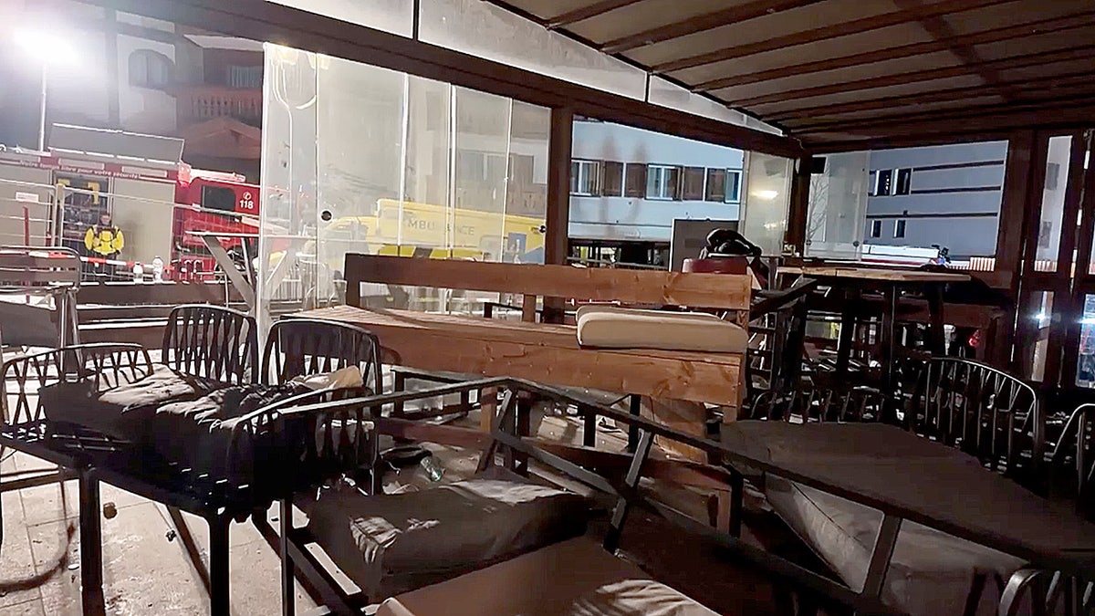 Tables and chairs inside bar in Switzerland where fire broke out