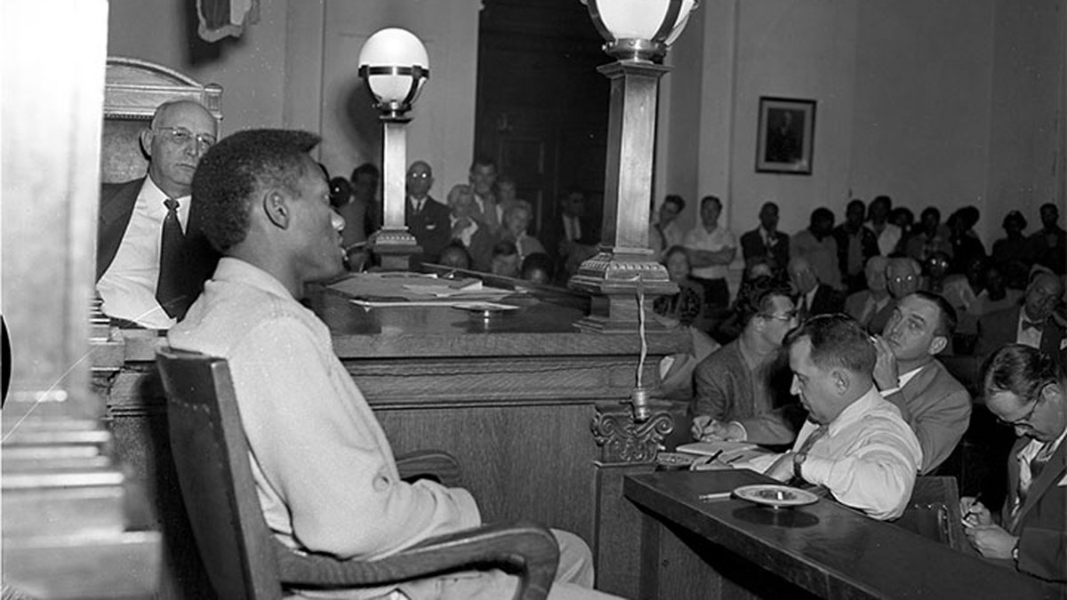 Tommy Lee Walker sits connected  the stand