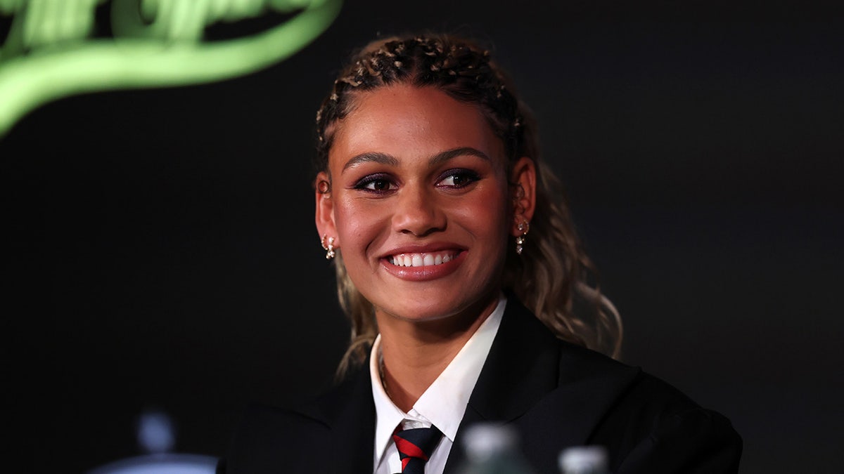 Trinity Rodman smiles