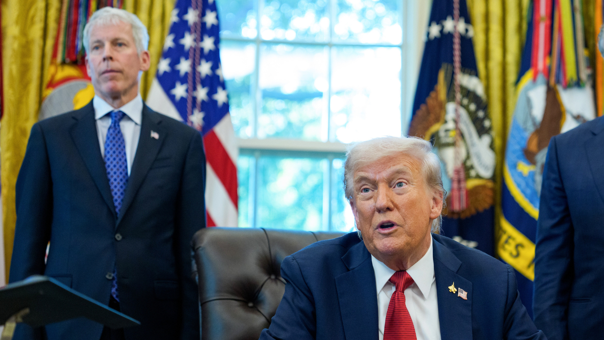 U.S. energy secretary Chris Wright and President Donald Trump are seen in the Oval Office.