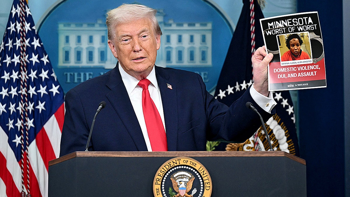 President Trump holds up an images of a criminal illegal alien