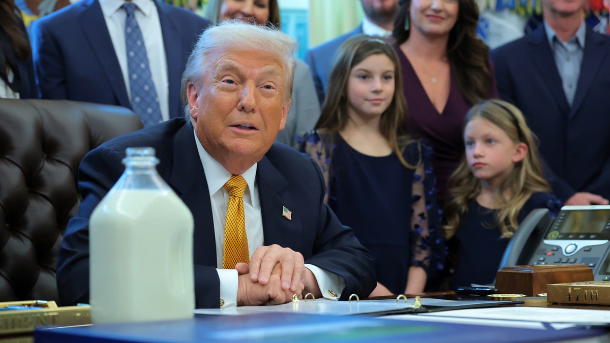 president donald trump with children in oval office for whole milk bill signing
