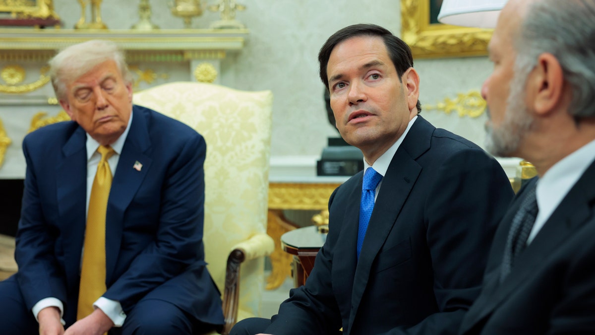 U.S. Secretary of State Marco Rubio speaking to reporters in the Oval Office with President Donald Trump and Secretary of Commerce Howard Lutnick