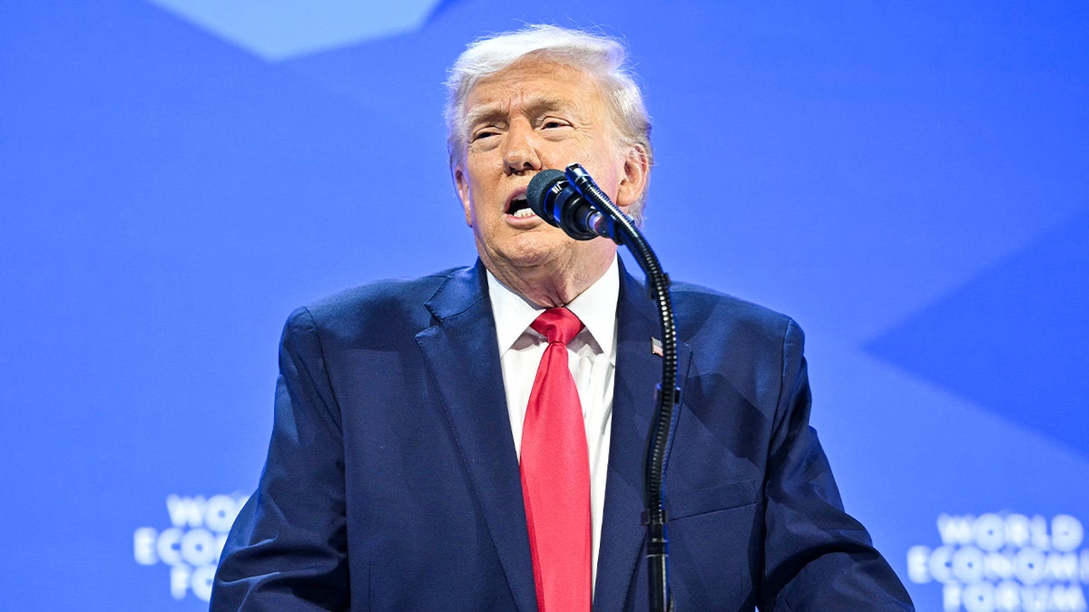 The U.S. president speaks on stage before an audience at an international forum.