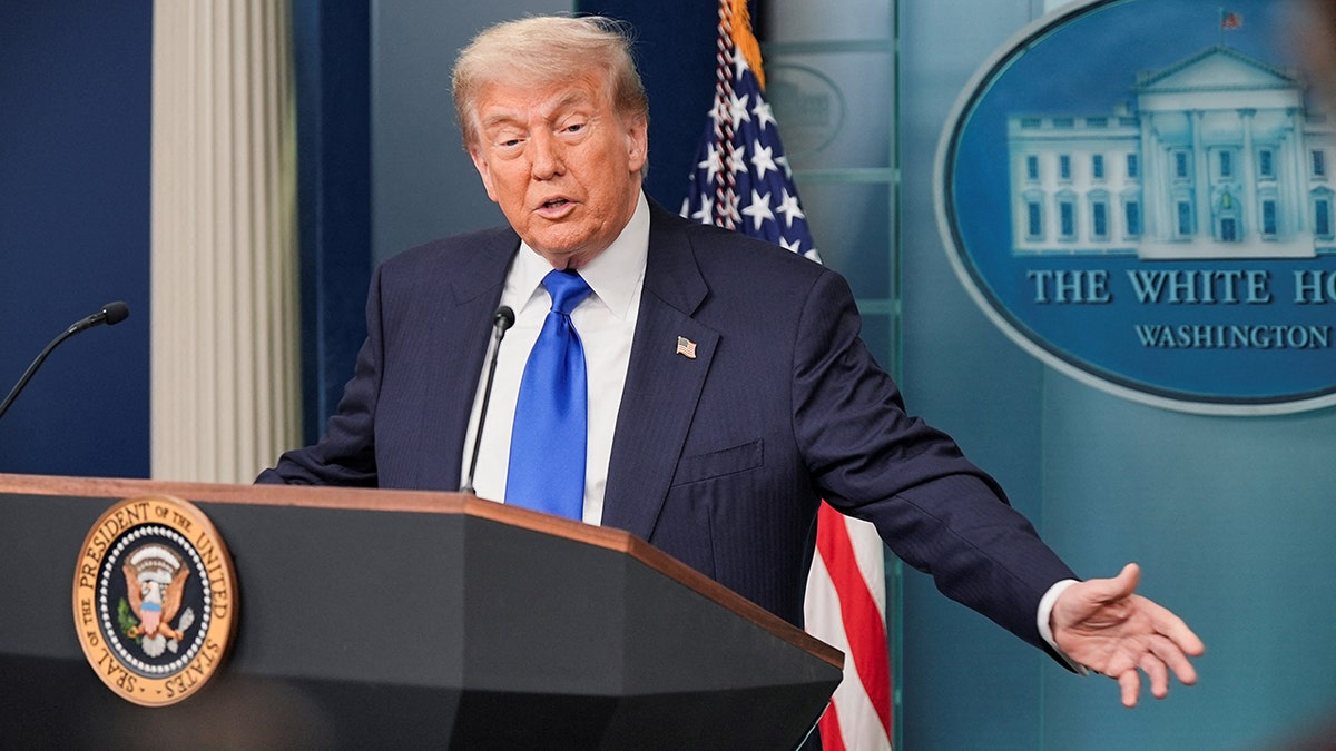 President Donald Trump gestures during White House press briefing