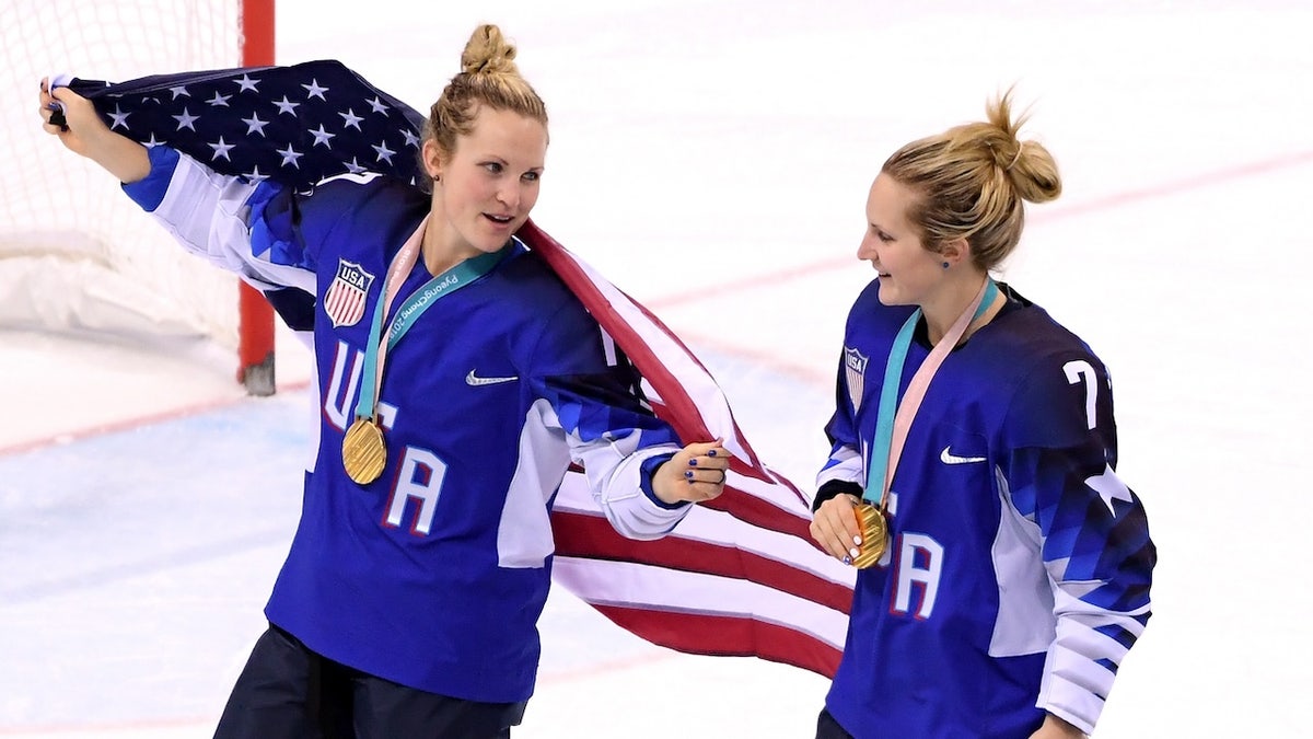 USA women's crystal  hockey golden  medal winners Jocelyne Lamoureux, left, and Monique Lamoureux-Morando aft  beating Canada successful  the PyeongChang 2018 Winter Olympic Games successful  Gangneung, South Korea. 