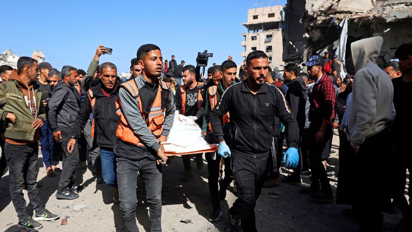 Rescuers carry the body of a victim amid debris following an Israeli airstrike on a police station in Gaza City on Jan. 31, 2026, according to Gaza’s Hamas-run Health Ministry. (Omar Al-Qattaa/AFP via Getty Images)