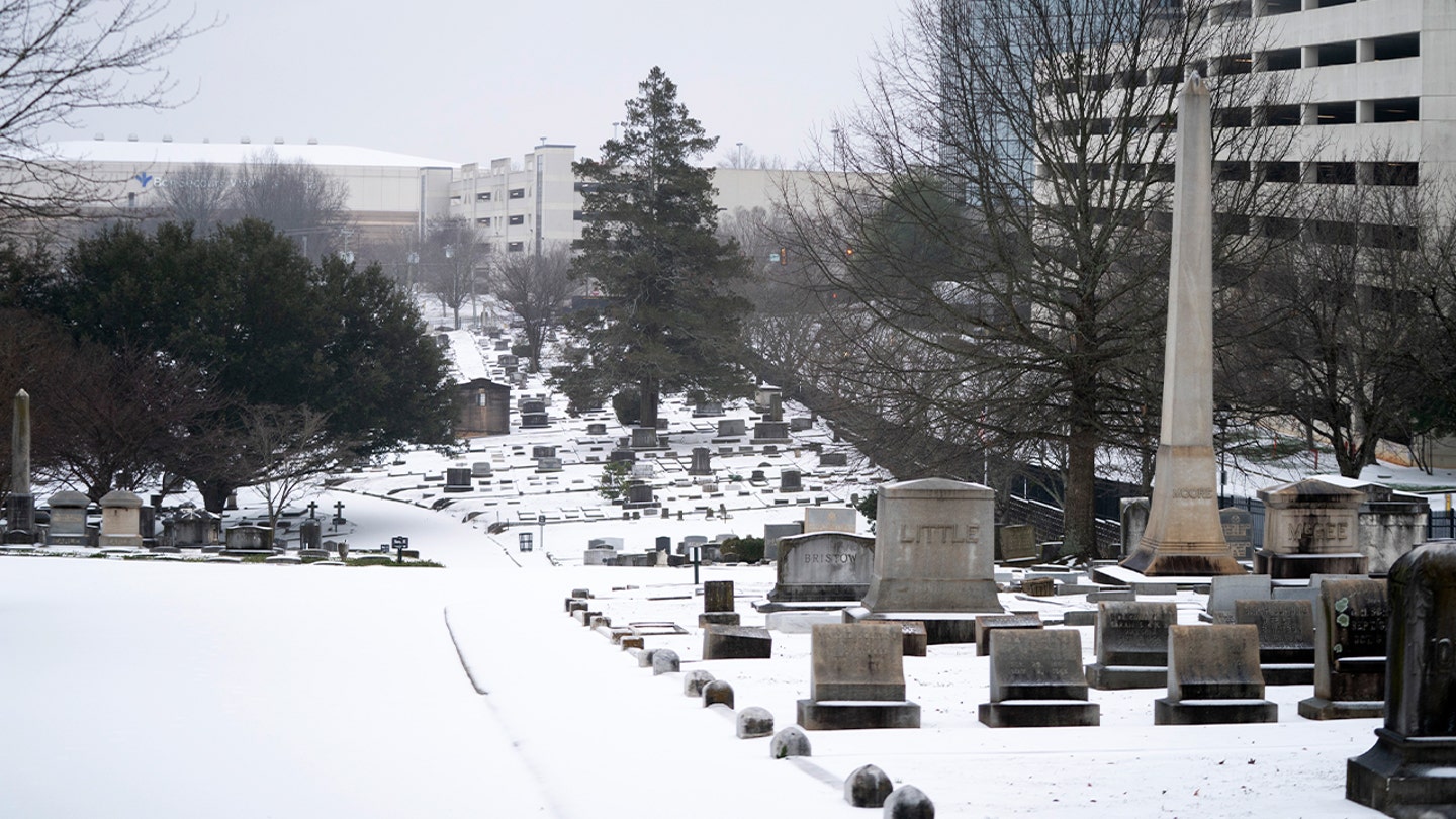 A wintery mix of precipitation covers the Springwood Cemetery on Jan. 25, 2026, in Greenville, S.C. (Sean Rayford/Getty Images)