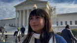 Chloe Cole in front of the Supreme Court.
