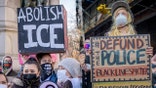 Protestors carrying signs