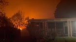 A home burns as flames from the Eaton Fire spread through Altadena, California.