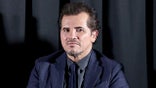 John Leguizamo wears a navy suit at a New York movie premiere