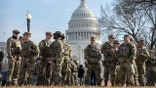 National Guard troops stand near U.S. Capitol Building in Washington, D.C.