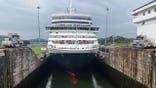 The cruise ship Queen Elizabeth transits through Miraflores Locks in Panama City on Oct. 9, 2025.