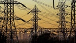Power lines and a cityscape.