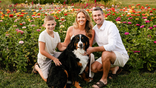 The Pung family posing with dog in flower field prior to their Supreme Court case