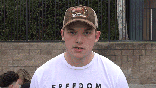 Gif thumbnail of people speaking to camera on sidewalk at event