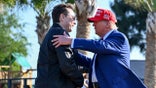 Elon Musk and Donald Trump embrace