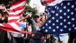 Pro-Nicolas Maduro protesters in Venezuela destroy American flag