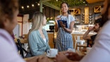 Waitress talking to customers