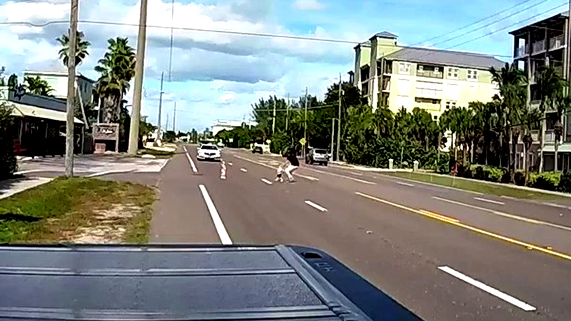 Man runs into Florida street to save two young children who wandered away from rental home