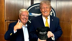 Trump signs 'Make Iran Great Again' hat alongside Lindsey Graham