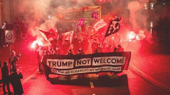 American flags torched, riot police clash with protesters ahead of Trump Davos arrival - Fox News