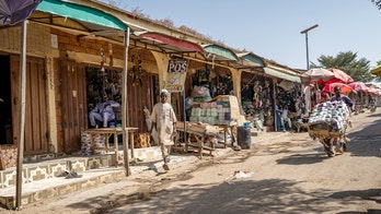 Massacre at Nigerian market leaves more than 30 dead as gunmen torch stalls, kidnap others