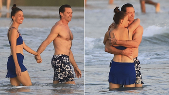 Hugh Jackman and Sutton Foster pack on the PDA in their swimsuits during Costa Rican getaway